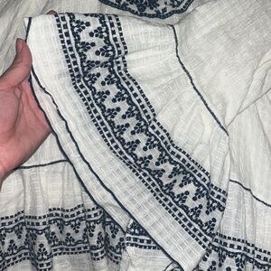 Super fun bohemian bell sleeve blouse with ruffle detail!